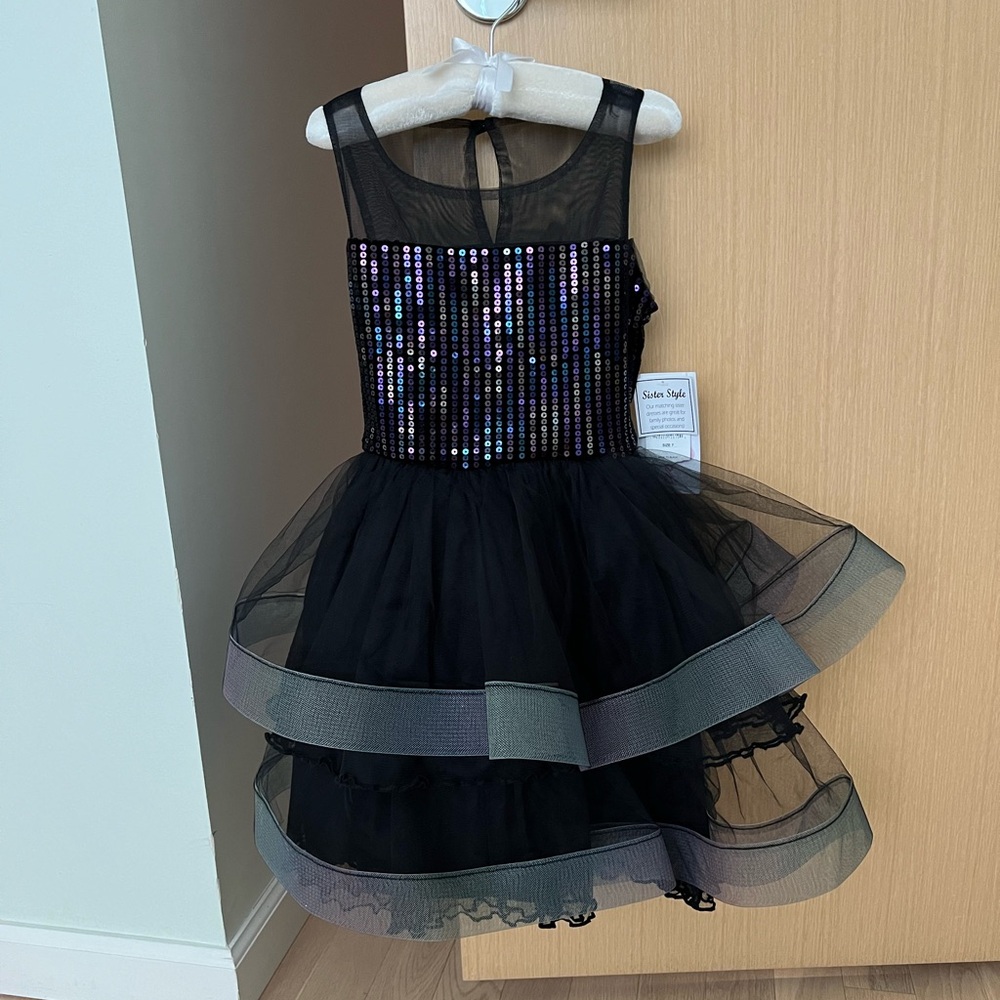 Black sleeveless dress with tulle skirt and sequin and velvet bodice, size 7.